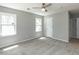 Inviting bedroom with great natural light, carpet floors, and overhead fan at 519 Touchstone Dr, Durham, NC 27713