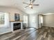 Bright living room boasts vaulted ceilings, wood-look floors, a fireplace, and ample natural light at 519 Touchstone Dr, Durham, NC 27713