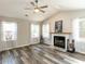 Inviting living room features wood-look floors, a fireplace, bright windows, and neutral paint at 519 Touchstone Dr, Durham, NC 27713