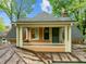Balcony exterior highlighting the charming architectural details, roofline, and surrounding greenery at 524 S Boylan Ave, Raleigh, NC 27603