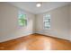 Bright bedroom featuring hardwood floors and windows that bring the outside in at 524 S Boylan Ave, Raleigh, NC 27603