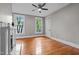 Spacious bedroom featuring hardwood floors, a ceiling fan, and abundant natural light at 524 S Boylan Ave, Raleigh, NC 27603