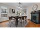 Dining room features a fireplace, chandelier, and doorway to another room at 524 S Boylan Ave, Raleigh, NC 27603