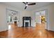 Spacious living room featuring hardwood floors, black fireplace, and wide doorway at 524 S Boylan Ave, Raleigh, NC 27603