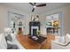 Elegant living room with hardwood floors, dual fireplaces, and a seamless transition to the dining area, perfect for entertaining at 524 S Boylan Ave, Raleigh, NC 27603