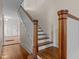 Elegant staircase with wooden banister and white spindles leads to the upper levels at 524 S Boylan Ave, Raleigh, NC 27603