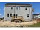 Exterior view of two-story house with a wooden deck at 54 Grove Township Way, Angier, NC 27501
