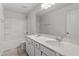 Bathroom featuring double sinks, a large countertop, and a combination tub and shower at 54 Grove Township Way, Angier, NC 27501