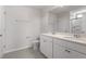 Bathroom with a double sink vanity, white cabinets, and tiled flooring at 54 Grove Township Way, Angier, NC 27501