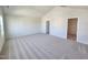 Large primary bedroom featuring a vaulted ceiling and a walk-in closet for ample storage at 54 Grove Township Way, Angier, NC 27501