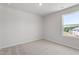 Bright bedroom with a large window offering pleasant outdoor views at 54 Grove Township Way, Angier, NC 27501