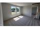 Bright bedroom with two windows providing natural light and plush carpeting throughout at 54 Grove Township Way, Angier, NC 27501