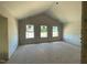 Spacious bedroom with large windows and high ceilings, ready for personalization at 54 Grove Township Way, Angier, NC 27501