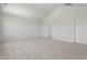 Well lit empty bonus room with high ceilings and open doorway at 54 Grove Township Way, Angier, NC 27501
