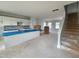 A kitchen with white cabinets, backsplash, and a spacious island under construction at 54 Grove Township Way, Angier, NC 27501
