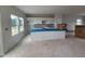 Contemporary kitchen with white cabinets, an island, and modern fixtures at 54 Grove Township Way, Angier, NC 27501