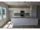 Spacious kitchen island features granite countertops and ample seating for casual dining at 54 Grove Township Way, Angier, NC 27501