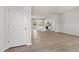 Bright, open-concept living room with modern flooring and neutral paint, flowing into the kitchen at 54 Grove Township Way, Angier, NC 27501