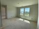 Bright room with large windows offering natural light and scenic views at 54 Grove Township Way, Angier, NC 27501