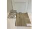 Sample board featuring white cabinets, luxury vinyl flooring, granite countertop, and tile backsplash at 54 Grove Township Way, Angier, NC 27501