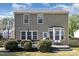 Exterior of home featuring a well-maintained yard, deck, and neutral siding at 5413 Botany Bay Dr, Raleigh, NC 27616