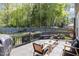 View of the deck with outdoor furniture and backyard overlooking the fenced yard and mature trees at 5413 Botany Bay Dr, Raleigh, NC 27616