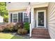 Welcoming front porch with brick steps and a storm door entrance at 5413 Botany Bay Dr, Raleigh, NC 27616