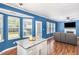 Open kitchen/living room with island, wood floors, and lots of light at 5413 Botany Bay Dr, Raleigh, NC 27616