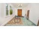 Sunny room with large windows, a rug, and a view of the outdoors at 545 Billy Fitts Rd, Siler City, NC 27344