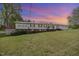 Charming single-story home featuring a metal roof, white siding, and well-maintained lawn at 545 Billy Fitts Rd, Siler City, NC 27344