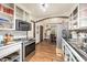 Kitchen featuring a stainless steel oven and microwave plus white cabinets at 545 Billy Fitts Rd, Siler City, NC 27344