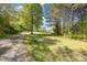 View of the long driveway leading to a charming home and yard at 545 Billy Fitts Rd, Siler City, NC 27344