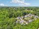 An aerial view of the beautiful homes in this community surrounded by lush green trees and blue skies at 5708 Butter Churn Way, Fuquay Varina, NC 27526