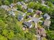 An aerial view of the homes in this community with mature landscaping and trees surrounding each property at 5708 Butter Churn Way, Fuquay Varina, NC 27526