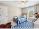 Bedroom with blue accents including a patterned rug, and a bed with a blue quilt and pillows at 5708 Butter Churn Way, Fuquay Varina, NC 27526