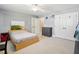 Comfortable bedroom with natural light, gray dresser, and neutral colored walls at 5708 Butter Churn Way, Fuquay Varina, NC 27526