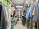 Spacious walk-in closet with organized shelving and ample storage for clothes and accessories at 5708 Butter Churn Way, Fuquay Varina, NC 27526