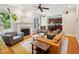 Bright living room showcasing hardwood floors, fireplace, and access to the kitchen at 5708 Butter Churn Way, Fuquay Varina, NC 27526