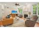 Cozy living room features a fireplace, hardwood floors, neutral paint, and comfortable seating at 5708 Butter Churn Way, Fuquay Varina, NC 27526