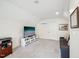 Cozy bonus room with TV, sofa, and modern mini-split system for climate control at 5708 Butter Churn Way, Fuquay Varina, NC 27526