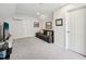 Bonus room featuring a comfortable sofa and entertainment area for relaxing at 5708 Butter Churn Way, Fuquay Varina, NC 27526
