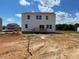 Exterior backyard view featuring a spacious yard with deck, perfect for outdoor activities and relaxation at 59 Grove Township Way, Angier, NC 27501