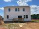 Exterior backyard view features a spacious yard with deck, perfect for relaxation and outdoor enjoyment at 59 Grove Township Way, Angier, NC 27501