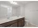 Bathroom featuring double sinks, a large mirror, and a shower and tub combo at 59 Grove Township Way, Angier, NC 27501