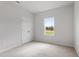 Bedroom with a neutral color scheme, plush carpeting, and a double door closet at 59 Grove Township Way, Angier, NC 27501