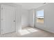 Cozy bedroom featuring plush carpeting, a window with a field view, and a closet, perfect for relaxation at 59 Grove Township Way, Angier, NC 27501