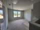 Bright bonus room with multiple windows and neutral paint at 59 Grove Township Way, Angier, NC 27501