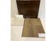 This image showcases cabinet, countertop, and flooring color and material selections for a new home at 59 Grove Township Way, Angier, NC 27501