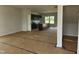 Open kitchen featuring dark cabinets, a spacious island, and modern lighting at 59 Grove Township Way, Angier, NC 27501