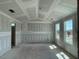 Living room featuring unfinished drywall and large windows offering plenty of sunlight, perfect for your personal style at 59 Grove Township Way, Angier, NC 27501